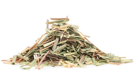 Pile of lemongrass dried herb for tea isolated on a white background. Dried Cymbopogon.の写真素材