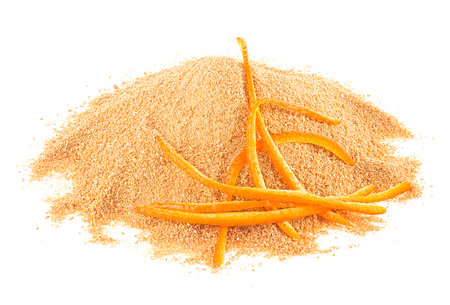Dried orange peel powder and fresh orange peel isolated on a white backgroundの写真素材