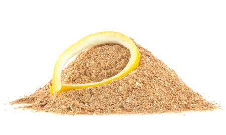 Pile of dried lemon peel powder and fresh lemon skin isolated on a white backgroundの写真素材