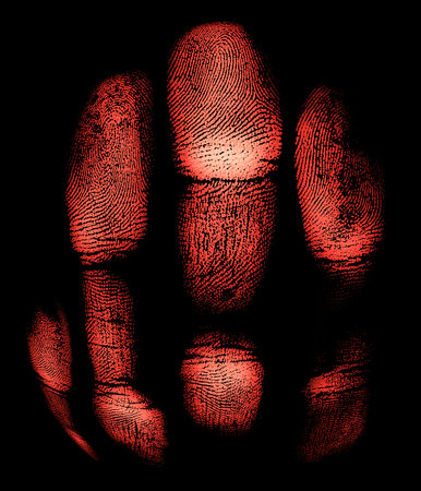Red imprint of hand on a dark background. Halloween.の写真素材