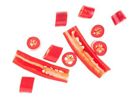 Chopped chili pepper with seeds isolated on a white background, top view. Raw food ingredient...