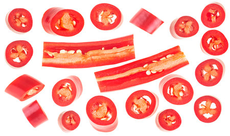Set of chopped chili pepper with seeds isolated on a white background, top view. Raw food ingredient concept.の写真素材