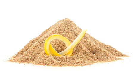 Pile of dried lemon peel powder and fresh lemon skin isolated on a white backgroundの写真素材