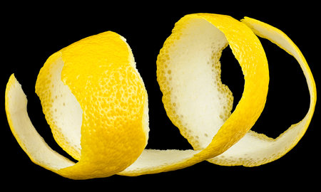 Fresh lemon fruit peel on a black background. Lemon twist.の写真素材