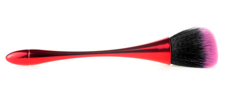 Red cosmetics brush isolated on a white background. Cosmetics and beauty.の写真素材