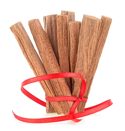 Pile of sandalwood sticks isolated on a white background. Sandalwood pieces. Chandan.の写真素材