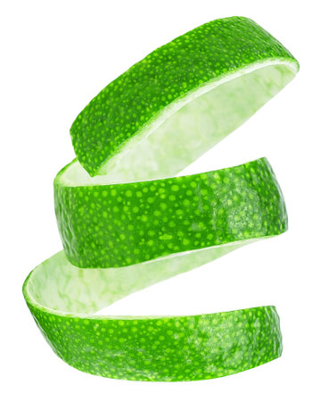 Lime peel isolated on a white background. Fresh lime zest. Vertical image.の写真素材
