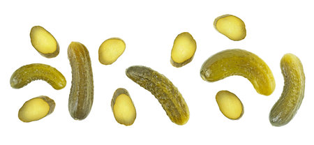 Marinated pickled cucumbers and slices isolated on a white background, top view.の写真素材