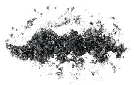 Charred paper isolated on a white background, view from above. Burnt paper scraps.の写真素材