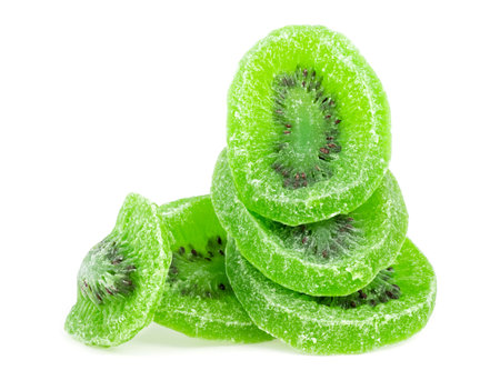 Dried kiwi fruit slices isolated on a white background. Candied kiwi fruit.の写真素材