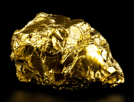 Pure gold ore on a black background. Gold nugget.の写真素材