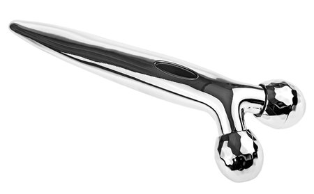Modern metal face roller isolated on a white background. Face massage tool and beauty treatment.の写真素材