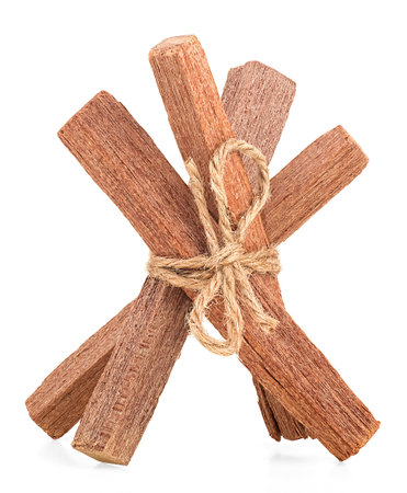 Sandalwood sticks tied with rope isolated on a white backgroundの写真素材