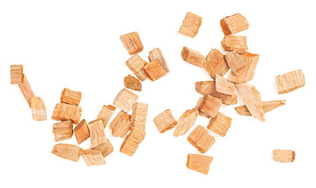 Chips for smoking meat and fish isolated on a white background, view from above. Pile of wood chips.の写真素材