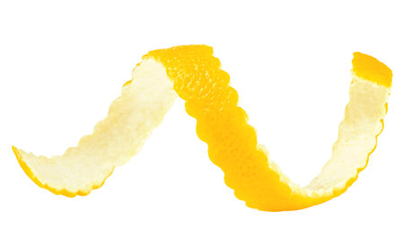 Lemon skin in spiral form isolated on a white background. Lemon twist or lemon zest.の写真素材
