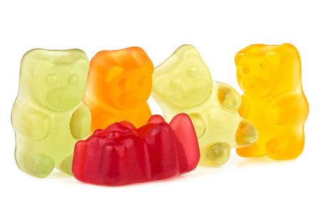 Colorful jelly gummy bears isolated on a white background. Delicious jelly treats.の写真素材