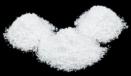 White snow isolated on a black background, close-up. Snow hills. Heap of snow.の写真素材