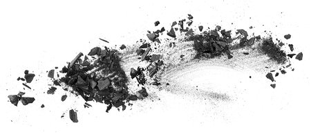 Black dust powder charcoal on a white background, top view. Wooden charcoal.の写真素材