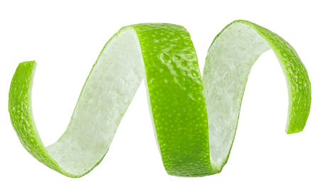 Curly lime peel twist isolated on a white background. Green lime zest.の写真素材