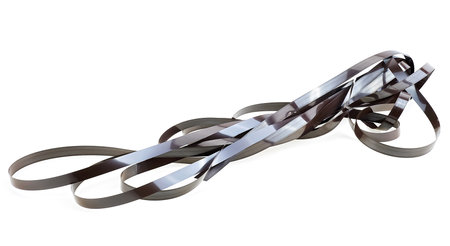 Close up of magnetic audio tape reel isolated on a white background. Music audio tape.の写真素材