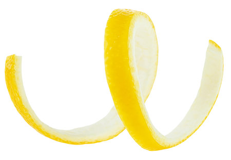 Spiral lemon peel isolated on a white background. Fresh lemon twist.の写真素材