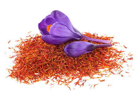 Pile of dried saffron and crocus flowers isolated on a white background. Saffron crocus threads.の写真素材