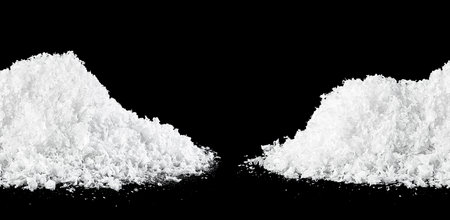 Snowdrifts isolated on a black background. White snow at night.の写真素材