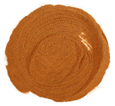 Pile of cinnamon powder isolated on a white background, top view.の写真素材