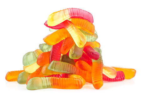 Pile of colorful jelly worm candies isolated on a white background. Sweet jelly candies.の写真素材