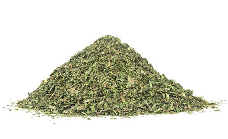 Pile of dried and chopped mint leaves isolated on a white backgroundの写真素材