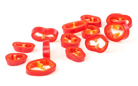 Red hot chili pepper slices isolated on a white backgroundの写真素材