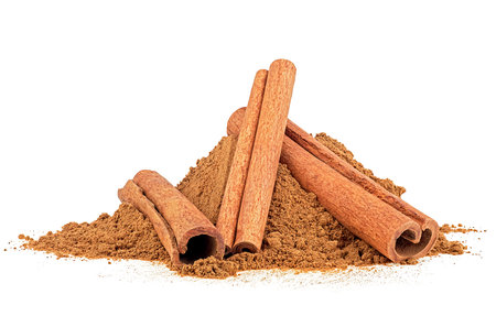 Cinnamon sticks and ground cinnamon isolated on a white background. Cinnamon spice.の写真素材