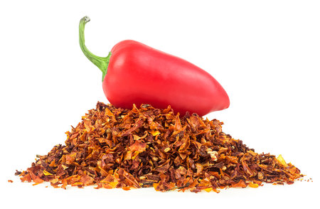 Red jalapeno pepper and pile of dried chili pepper flakes isolated on a white backgroundの写真素材