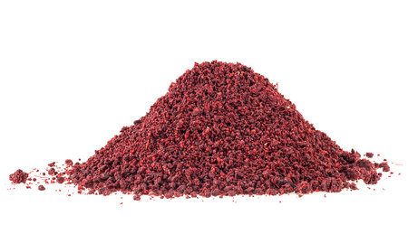 Pile of sumac spice isolated on a white background. Ground sumac spice powder.の写真素材