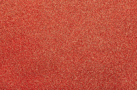 Abstract blurred red glitter texture background. Shiny red glitter background.の写真素材