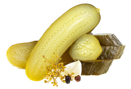 Tasty slices of pickled cucumber with garlic, dill and peppercorns isolated on a white background. Salted pickles.の写真素材