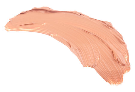 Beige stroke and texture of makeup foundation or acrylic paint isolated on a white background. Concealer. Makeup foundation creamy texture.の写真素材