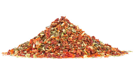 Pile of dried spices isolated on a white background. Dried and chopped tomatoes, garlic and basil leaves.の写真素材