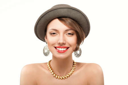 Funny summer portrait of smiling girl with red lips in hat, looking at camera