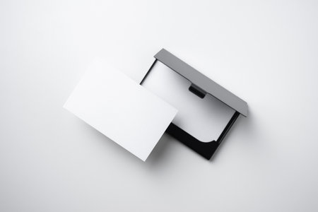 minimal, abstract, template concept with business card and business card case isolated on white background, for mock up, top view layout.の写真素材