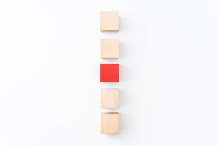 leadership, abstract, cooperation concept with red wood cube isolated on white background, for mock up, top view layout.の写真素材