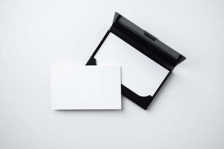 minimal, abstract, template concept with business card and business card case isolated on white background, for mock up, top view layout.の写真素材