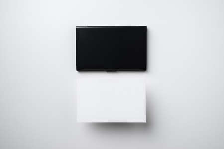 minimal, abstract, template concept with business card and business card case isolated on white background, for mock up, top view layout.の写真素材