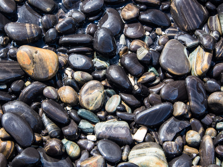 wet stone at the seasideの写真素材