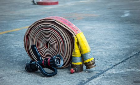 Fire-hose and nozzle on the rough ground