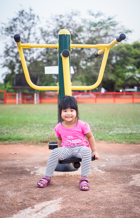 portrait of little girl exercise in the parkの写真素材