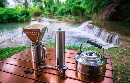 coffee drip while camping near the waterfallの写真素材