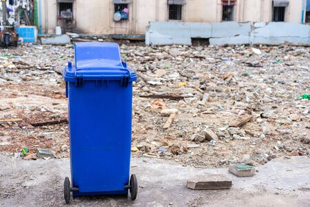blue trashcan with old building backgroundの写真素材