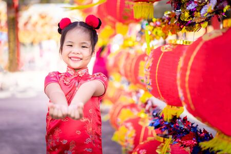 cute little asian girl in chinese traditional dress.Happy chinese new year concept.の写真素材