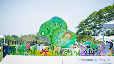 Bangkok,Thailand - January 13, 2018 : Little girl go to Festival of Tales in the Garden in Suan Luang Rama 9 public park on January 13, 2018 in Bangkok, Thailand.のeditorial素材